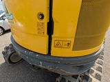 a close up of the front end of a yellow excavator