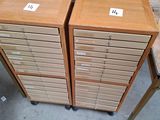 two wooden filing cabinets sitting on top of a table