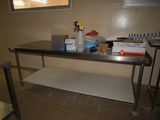 an image of a table in a room with a lot of stuff on it