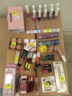 a lot of cosmetics and makeup products on a table