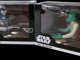 two star wars action figures are in a box