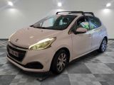 the small white car is parked in a room with a checkered floor