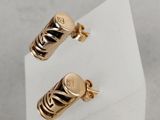 two pairs of gold plated earrings with zebra stripes on them