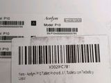a label on the back of a laptop with a barcode on it