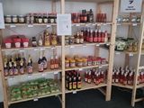 many shelves of different kinds of food and drinks