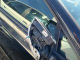 a car that has a broken window and a broken door handle
