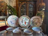 a lot of plates that are sitting on a table