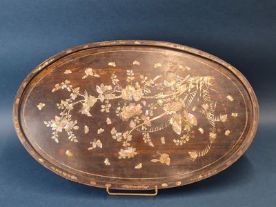 an old wooden tray with flowers and birds painted on it