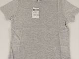 the children ' s t - shirt is grey and has a small tag on it
