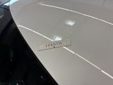 a ruler that is on the hood of a car