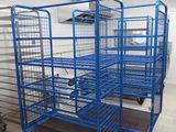 many blue carts in a room with white tile flooring