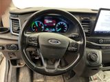 steering wheel and dashboard of a car with a tablet on the dashboard