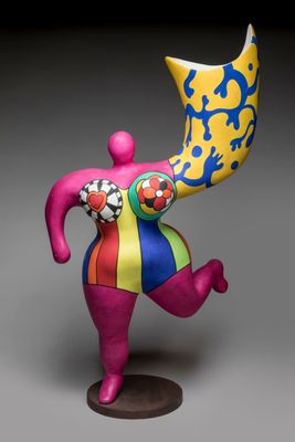 a close up of a figurine of a person holding a large object