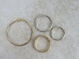 three different types of rings on a white surface