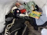 a pile of clothes and other items in a white bag