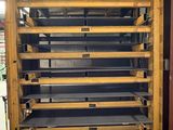 a rack of shelves in the middle of a room