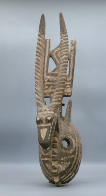 an image of a sculpture of a head with a bird on it