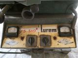 a machine that is sitting on the ground with a lot of gauges