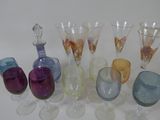 a lot of wine glasses and a decanter on the table