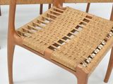 a wooden chair with a woven seat on it