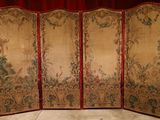 an image of a room divider with a red curtain in the background