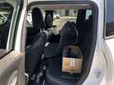 a box in the back seat of a car with the door open