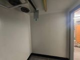 an image of a room with a door and a ceiling fan