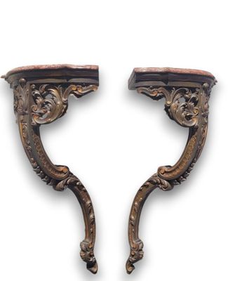 pair of carved wood wall brackets with marble top