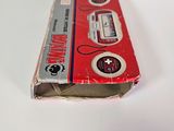 a box with a cassette inside of it on a white surface