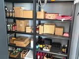 many boxes and bottles on the shelves in the room