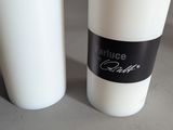 two cups of coffee sitting next to each other on a table