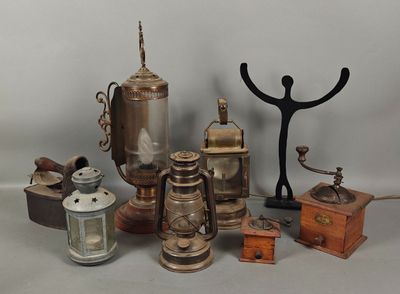 many different types of antique items displayed on a table