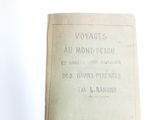 an old book with writing on it sitting on a table