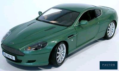 a green model of a car on a white surface