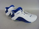 a close up of a pair of white and blue shoes