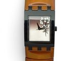 a watch that is sitting on a brown strap