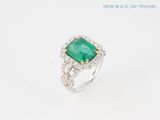 an emerald and diamond ring