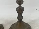 pair of antique brass candlesticks with flower decoration