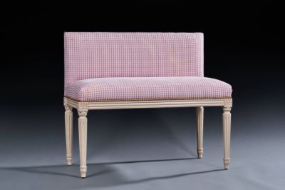 an upholstered bench with a pink and white checkered upholstered seat