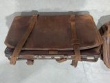 two pieces of luggage that are sitting on a table