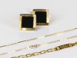 two pairs of gold and black enamel cufflinks and a chain