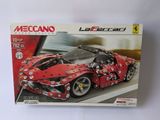 the box is open to show the model of a red sports car