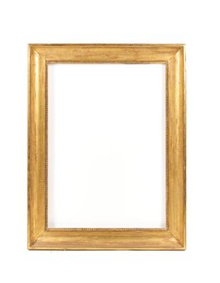 a gold frame on a white wall with a white background