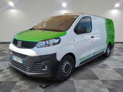 the green and white van is parked on a checkered floor