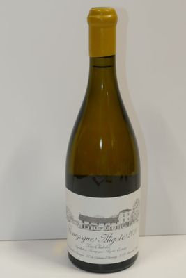 a bottle of wine that is sitting on a table