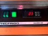 a close up of a counter top oven with a digital clock on it