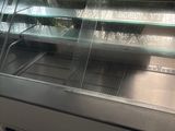 a refrigerated display case in a store