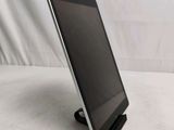 a tablet that is sitting on a stand on a table