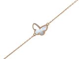 a gold chain bracelet with a white opal stone butterfly charm