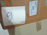 a cardboard box with a price tag on it